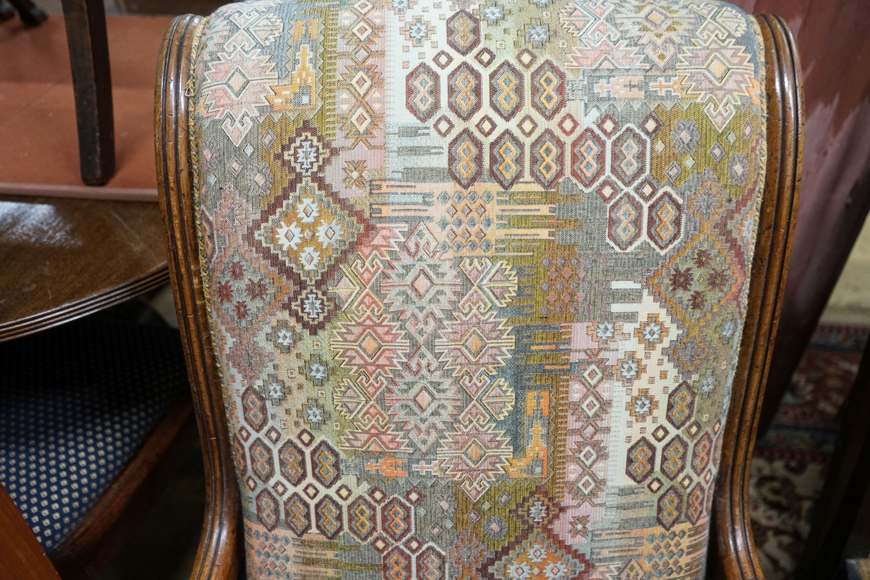 A Regency mahogany scroll armchair